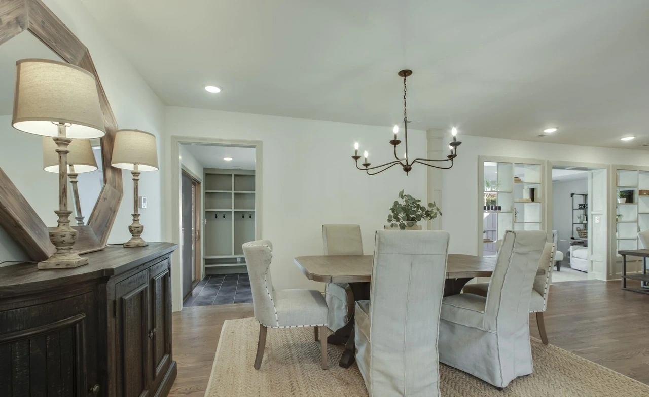 Dining room with wood floors and chandelier