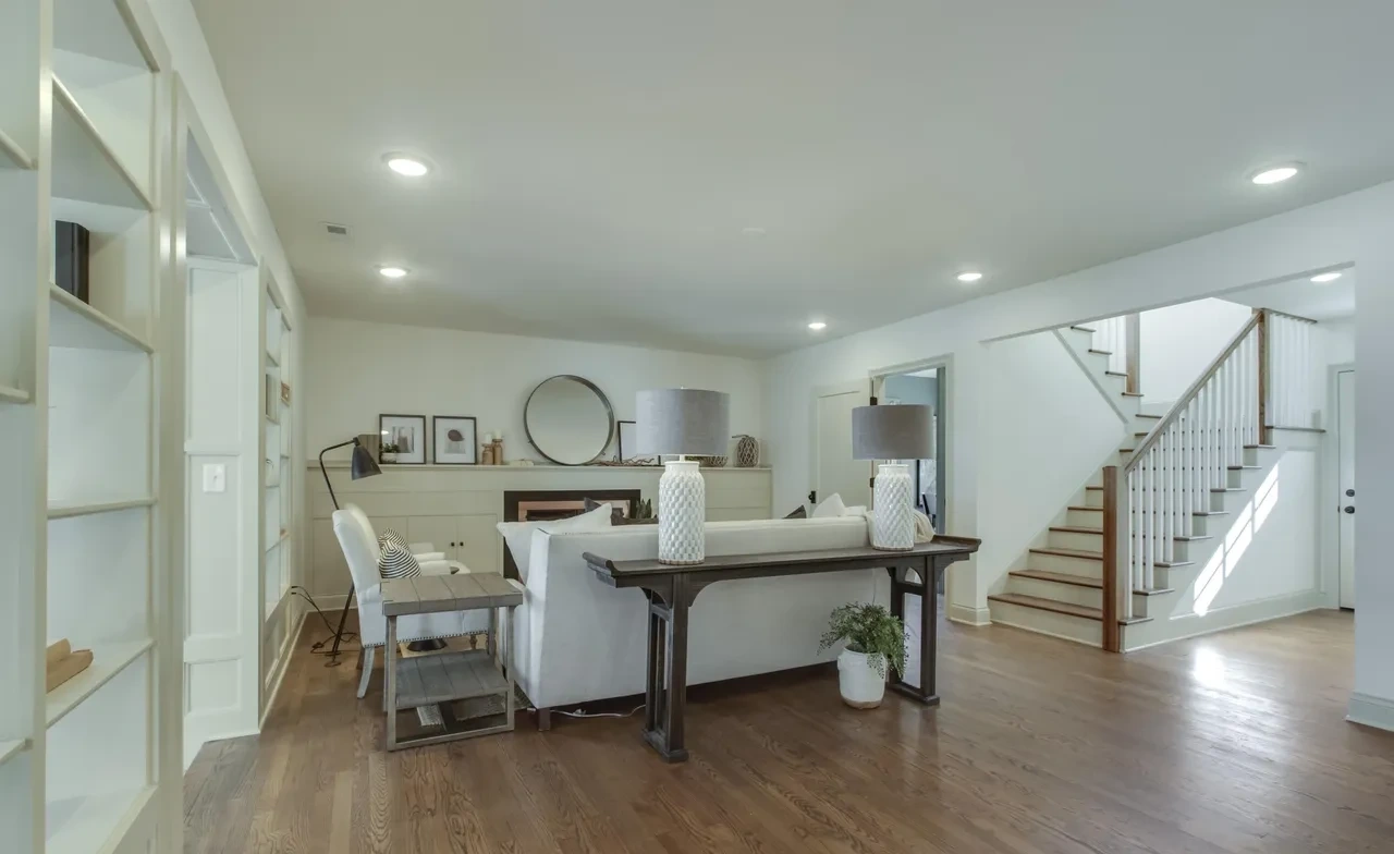 Open living and dining space with wood floors